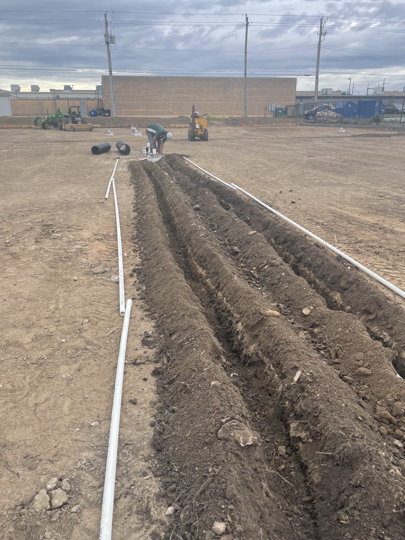 Irrigation trenches with pipe